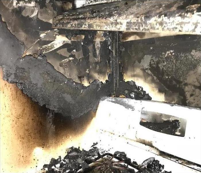 burned stove, hood and walls